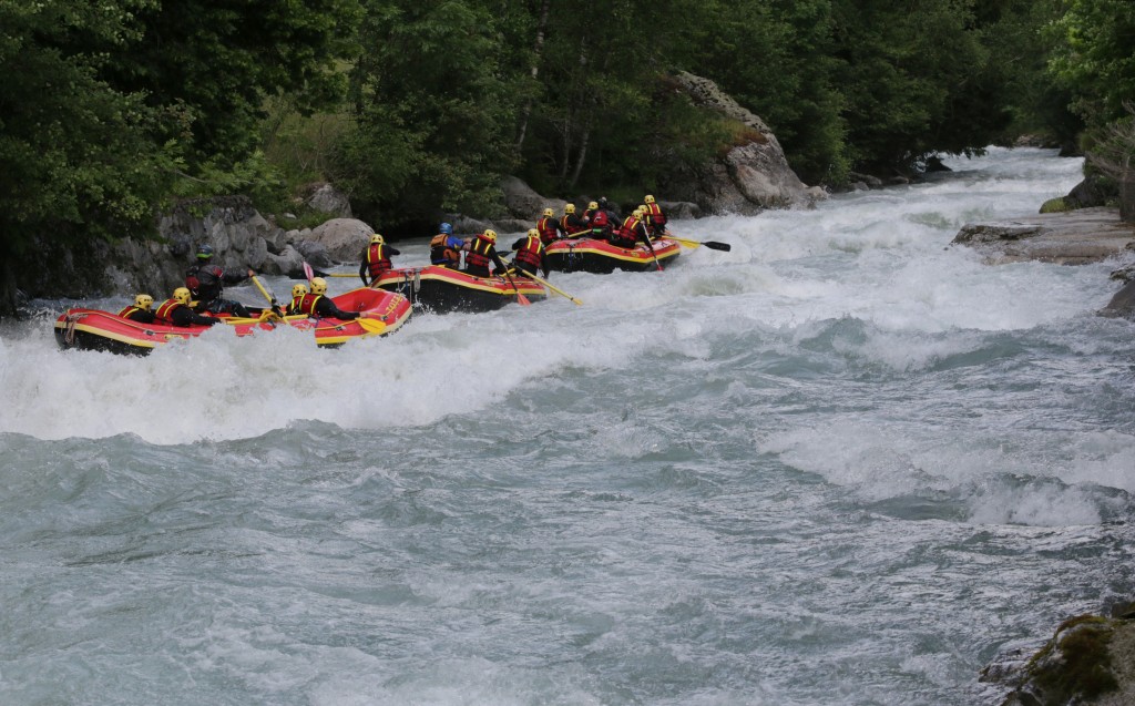 Years of river experience leads to this. A Rafting Train passing through Champex. Photo - Aurelien Sudan